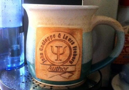 a beautiful coffee mug celebrating 7 years of research & work