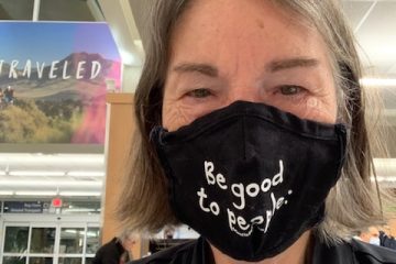 Author wearing her mask at an airport
